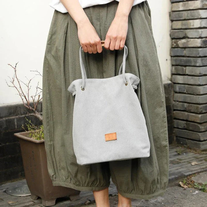 Premium canvas lattice shoulder bag in various colours, featuring a spacious design with secure zipper closure and adjustable strap for comfortable everyday carry