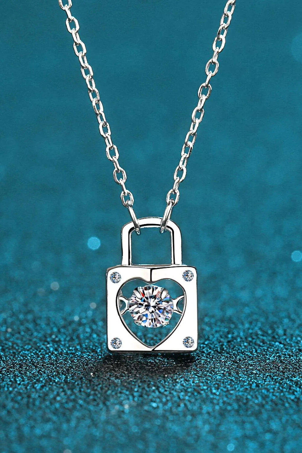Elegant sterling silver moissanite lock pendant necklace with a minimalist, modern design