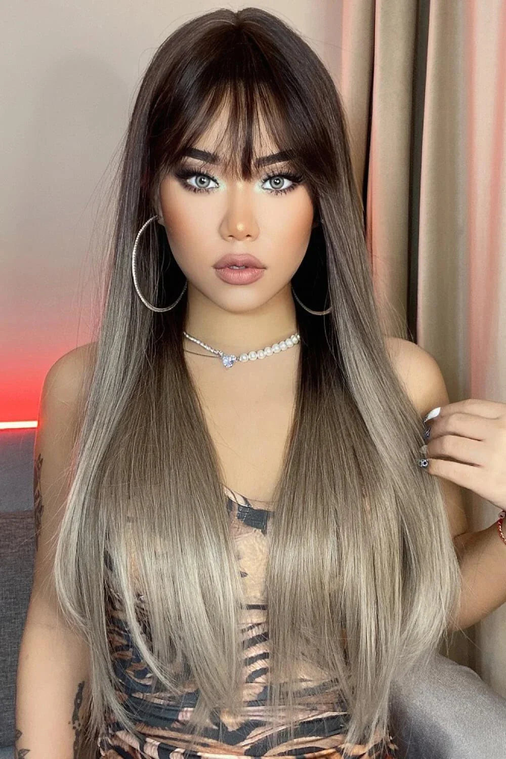 Stylish long straight synthetic wig with a comfortable cap and heat-safe design for versatile hair transformation