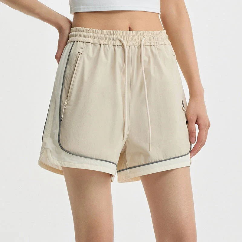 Premium quick-drying sports shorts for women with a trendy colour-block design and adjustable waist