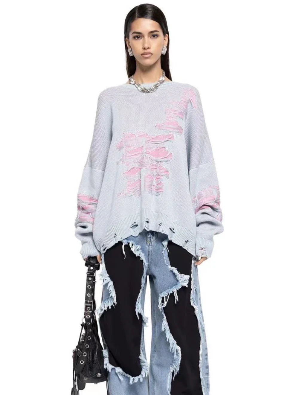 A stylish ripped long sleeve top in a variety of versatile colours, including grey, green, and black.