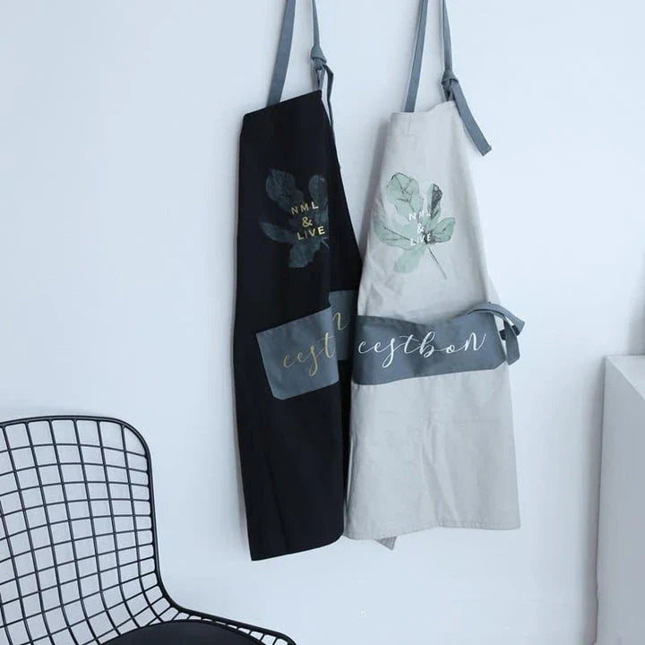 Premium cotton barista apron with a beautiful coconut leaf print design, perfect for coffee shop staff