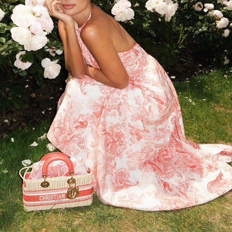 Sophisticated and versatile mid-length backless dress in a vibrant pink hue, featuring an A-line silhouette and convenient side pockets.