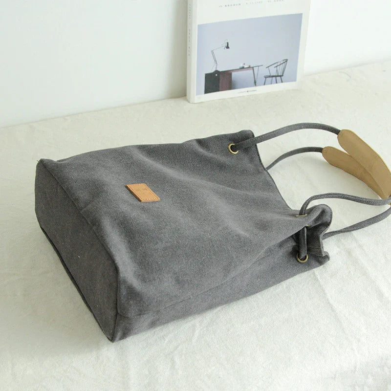 Premium canvas lattice shoulder bag in various colours, featuring a spacious design with secure zipper closure and adjustable strap for comfortable everyday carry