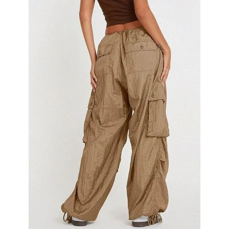 Stylish high-waist safari-inspired cargo trousers for women in black, featuring a comfortable, flattering fit and practical pockets.
