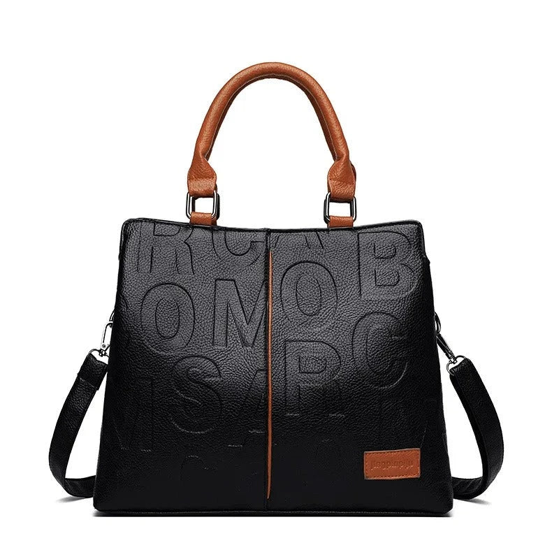 Sophisticated large leather tote bag with embossed lettering design, suitable for daily use and travel