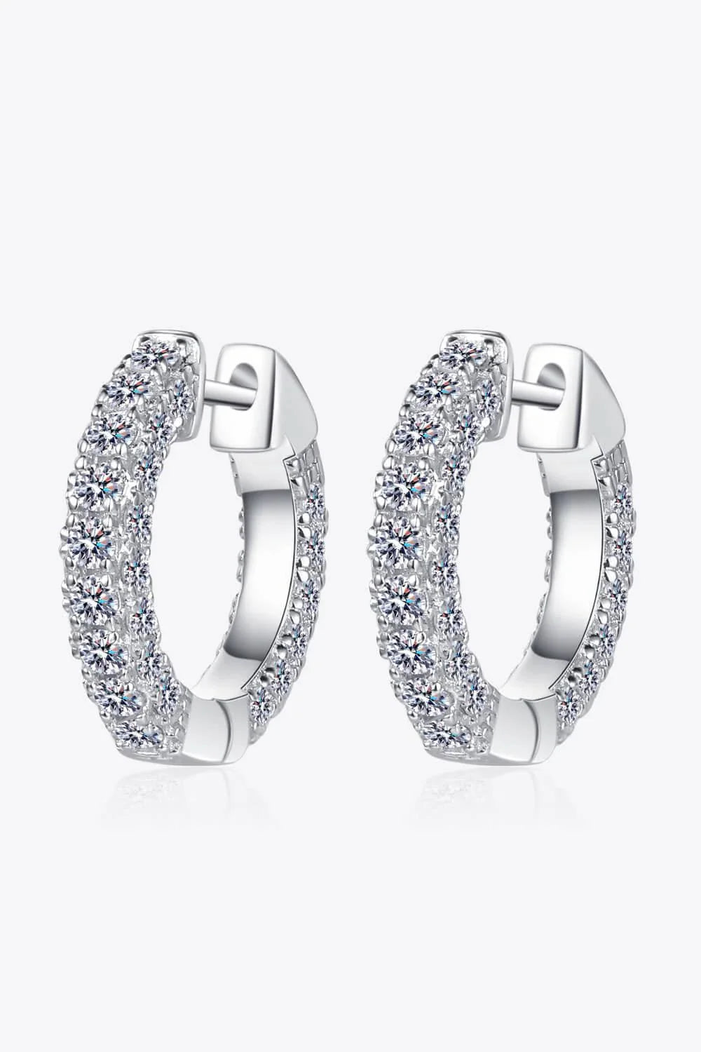 Elegant 925 sterling silver moissanite huggie earrings with a minimalist design and polished finish