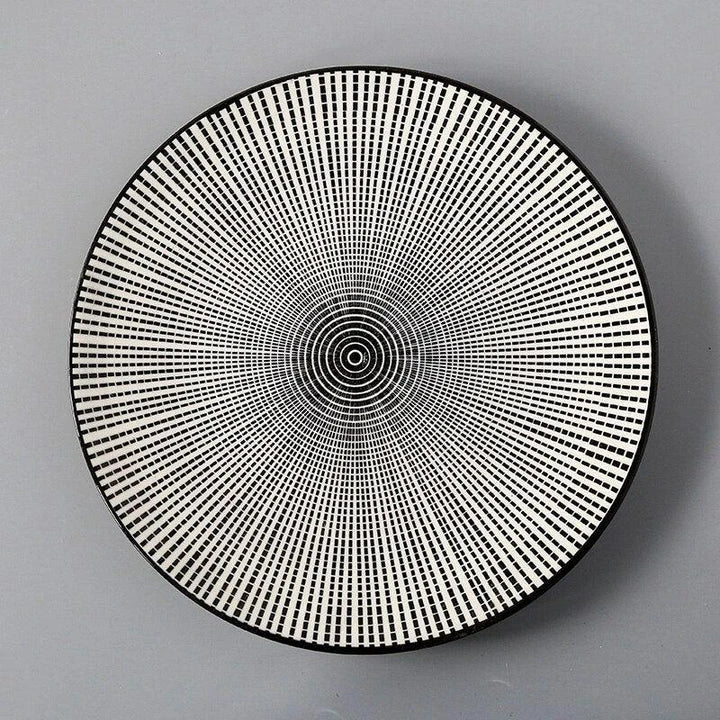Elegant ceramic plates with vibrant, whimsical prints in a variety of enchanting designs