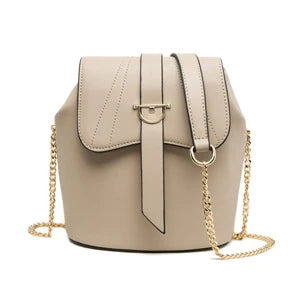 A large capacity chain bag with a classic bucket silhouette, crafted from premium leather-look material for sophisticated British style.