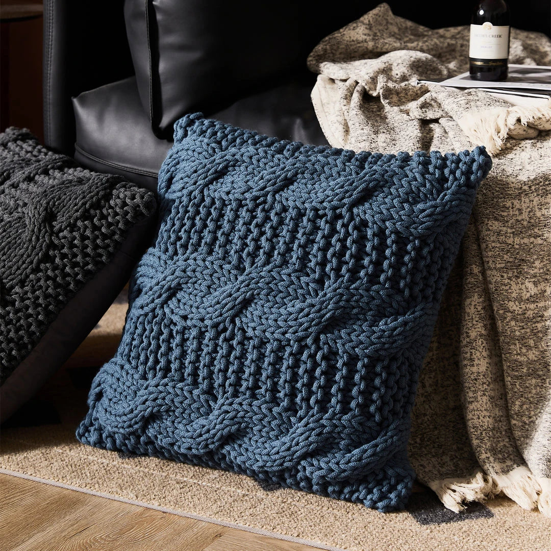 Luxurious hand-crocheted chunky knit throw pillow in a range of vibrant colours, providing cosy comfort and sophisticated style.