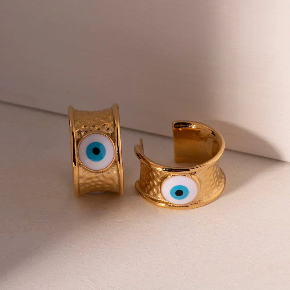 Luxury 18K gold-plated earrings with a unique Devil's Eye design and hammer grain texture in stainless steel