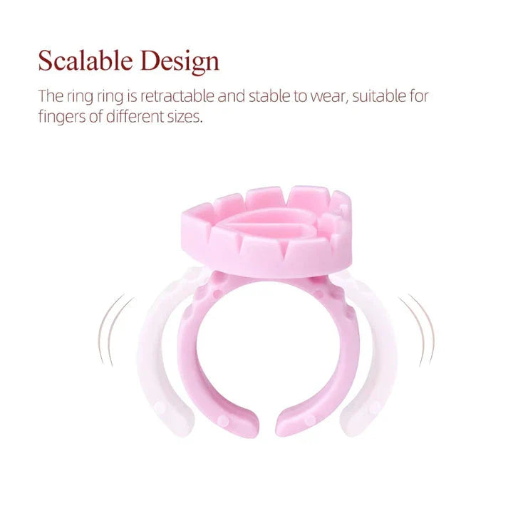 Heart-shaped disposable eyelash glue rings in blue, pink, and white colours