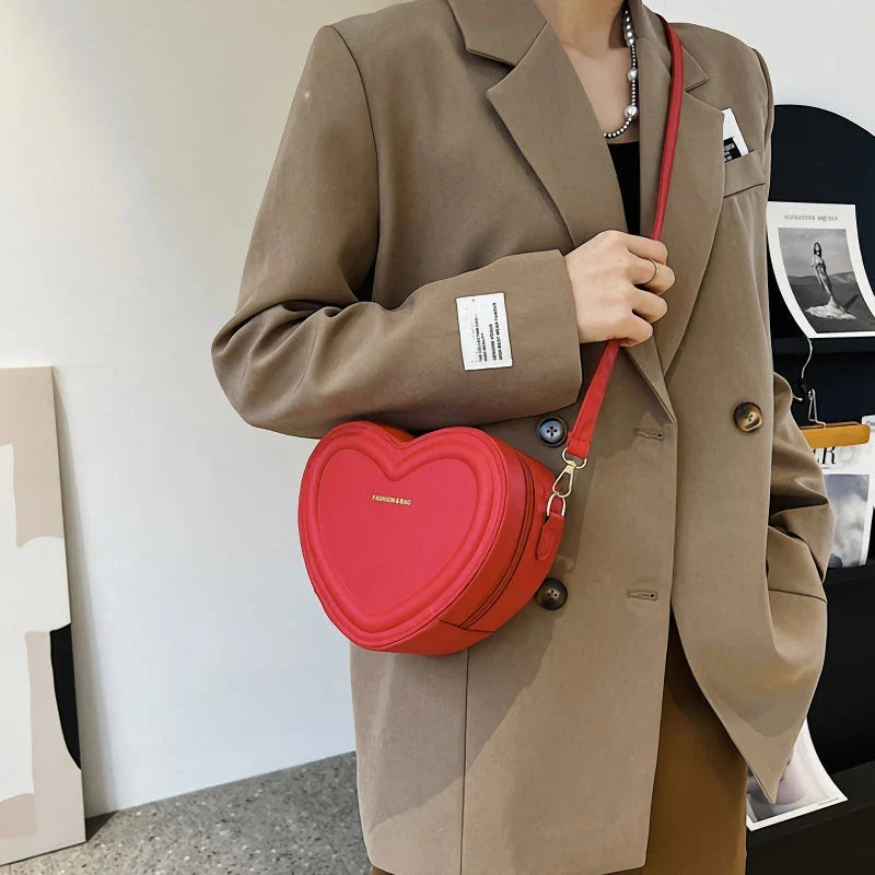 Chic heart-shaped crossbody bag made from premium PU leather, available in multiple stylish colours