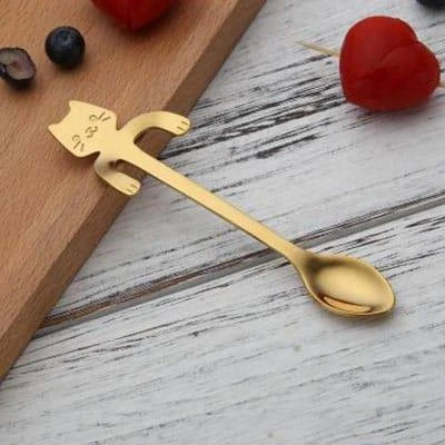 A silver cat-shaped stainless steel coffee spoon with a polished finish