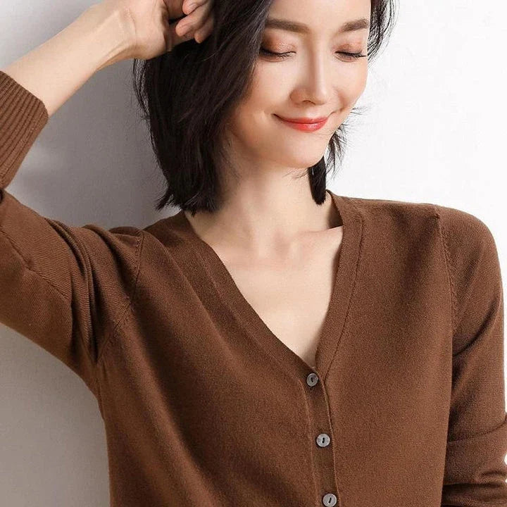 Chic v-neck single breasted cardigan in blue, green, and pink colours with a sophisticated and timeless design
