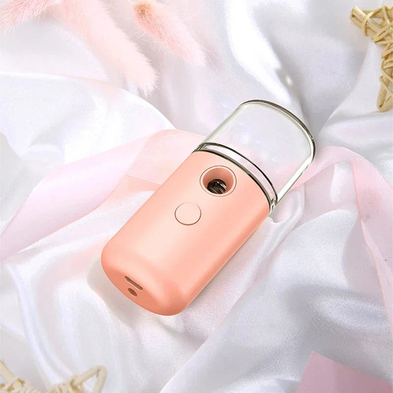Compact USB Powered Nano Facial Mist Sprayer in pink colour for deep hydration and a radiant glow
