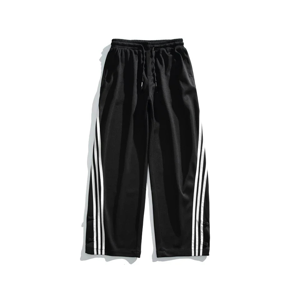 Stylish striped sports trousers in a relaxed, mid-waist design for versatile leisure and athletic wear