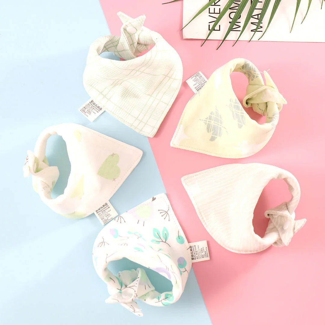 Stylish cotton baby bandana bibs in various fashionable prints, designed to keep your little one dry and comfortable.