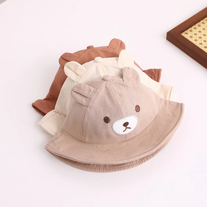 Adorable kids' bear-themed panama bucket hat with soft, breathable fabric and adjustable fit for sun protection and style
