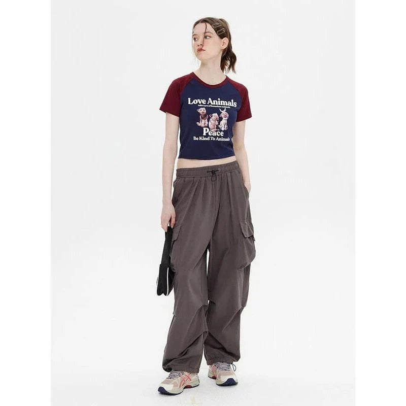 Charming Animal Print Raglan Crop Top with eye-catching graphic and contrasting sleeves