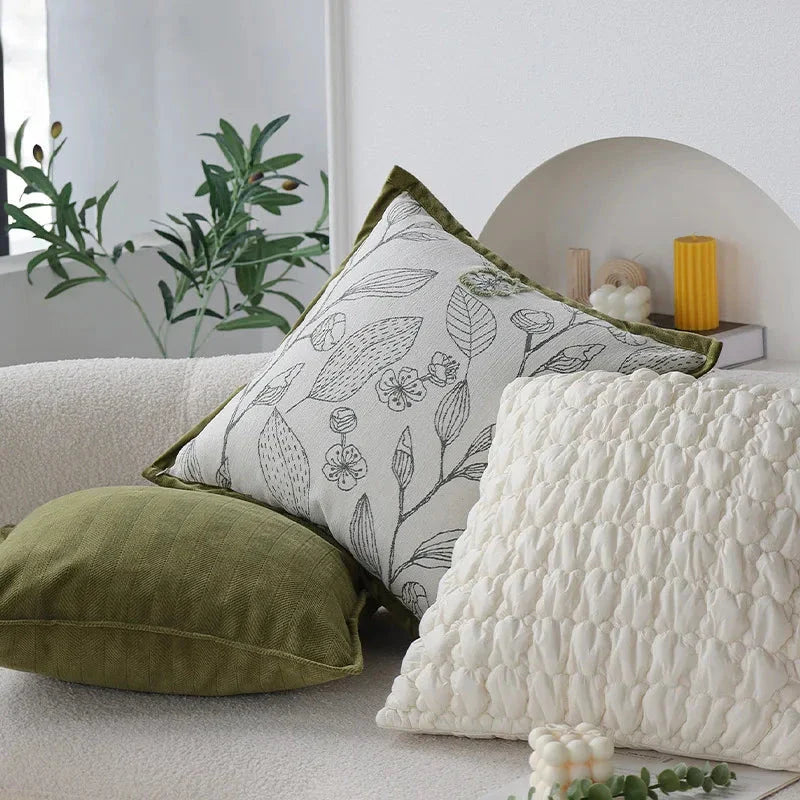 Luxurious cream and green jacquard cushion cover with a unique pattern, measuring 45 x 45 cm for a generous size and impactful presence.