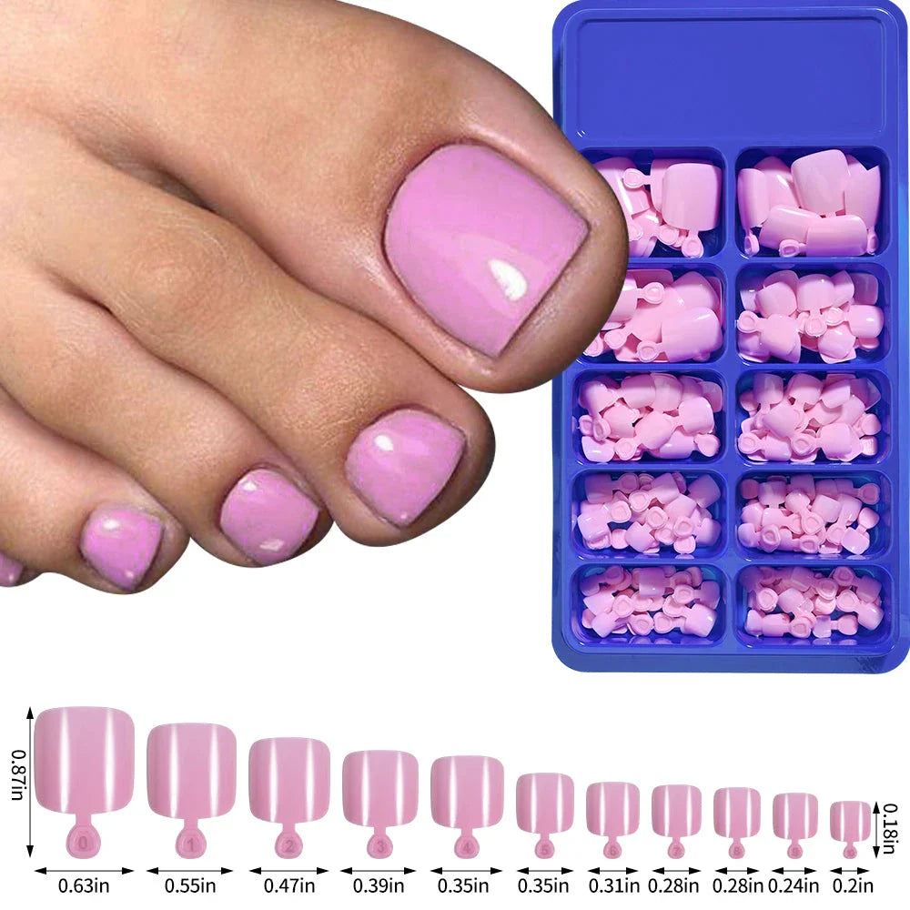 Elegant short square press-on toenails in vibrant pink, red, and nude shades for a polished and convenient pedicure