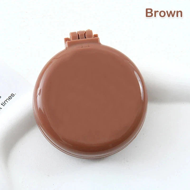 Compact folding hair comb with mirror, perfect for on-the-go touch-ups and styling for British customers