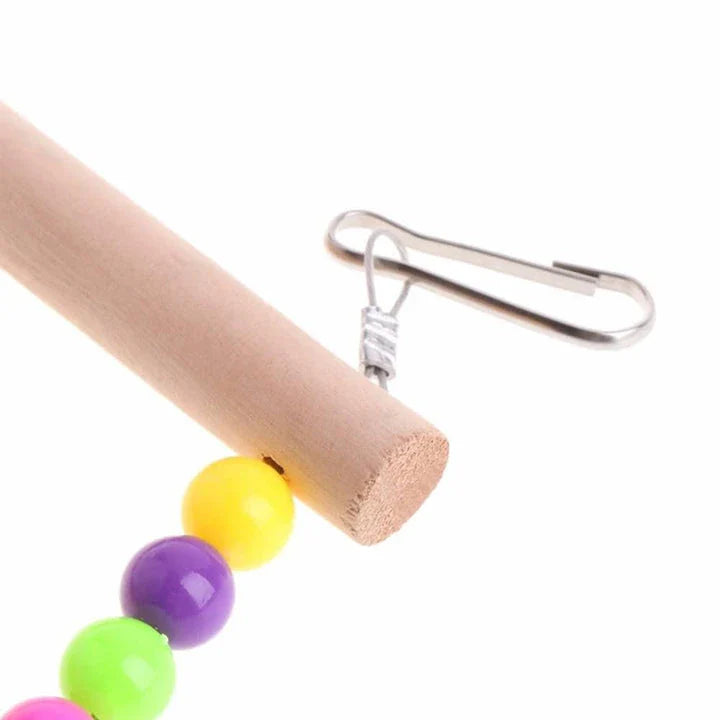 Sturdy wooden rainbow ladder with two hanging hooks, designed as a colourful climbing toy for pet birds