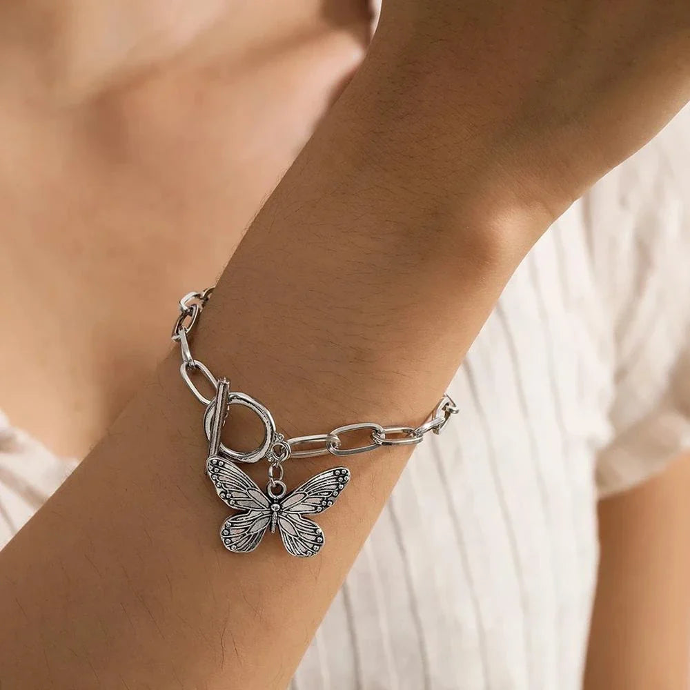 Silver butterfly pendant bracelet with a delicate chain and charming bowknot design