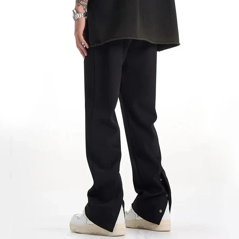 Sophisticated retro-style casual suit trousers in black and apricot colours, featuring a sleek straight-leg silhouette and distinctive back slit