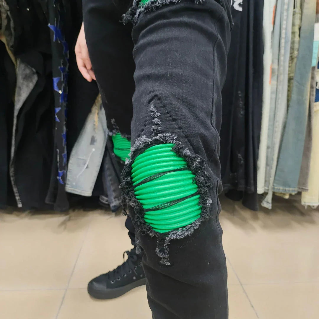 Premium ripped black jeans with stylish green patchwork design, made with medium-elastic fabric for comfort and a slim, flattering silhouette.