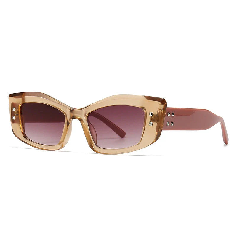 Retro cat eye sunglasses with rivet details, offering a stylish and protective eyewear solution.