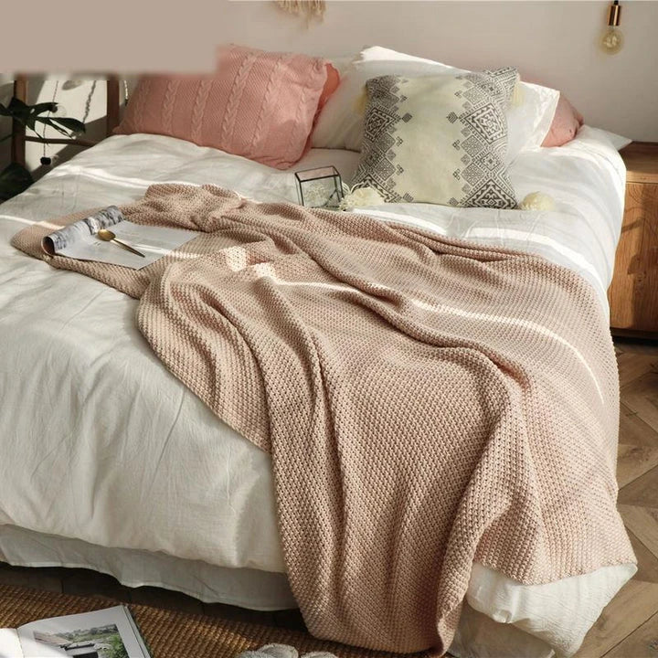Cosy and sophisticated oversized moss stitch knitted blanket in various colours, perfect for adding warmth and style to any living space
