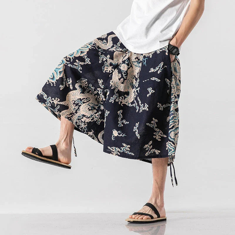 Men's loose-fitting Chinese-inspired cropped pants with a dragon or elephant floral pattern in navy blue, red, or coffee colours