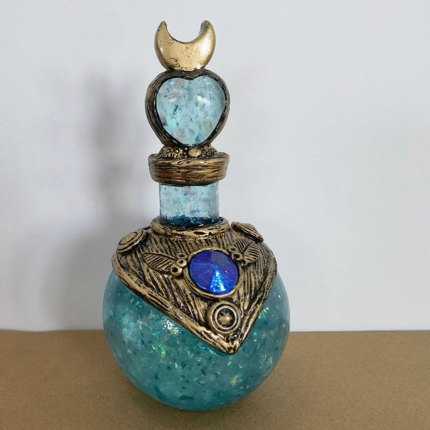 Shimmering resin mermaid bottle with iridescent tail, bathed in moonlight and captivating ambience