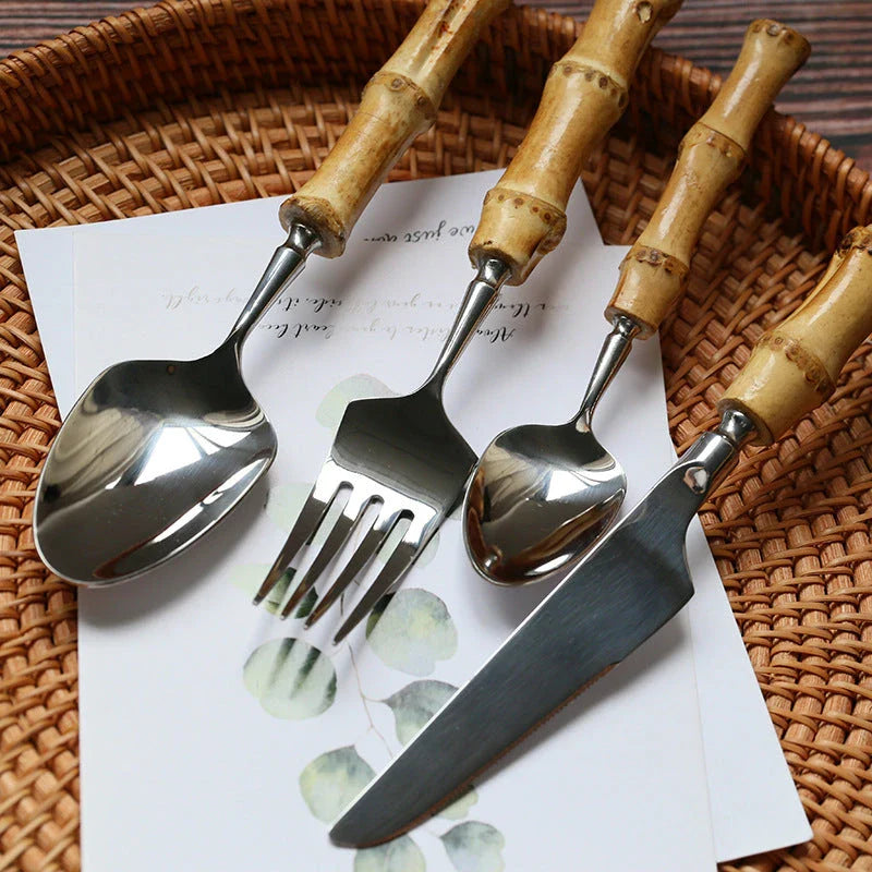 Mirror finish stainless steel cutlery set with bamboo handles, designed for elegant dining experiences