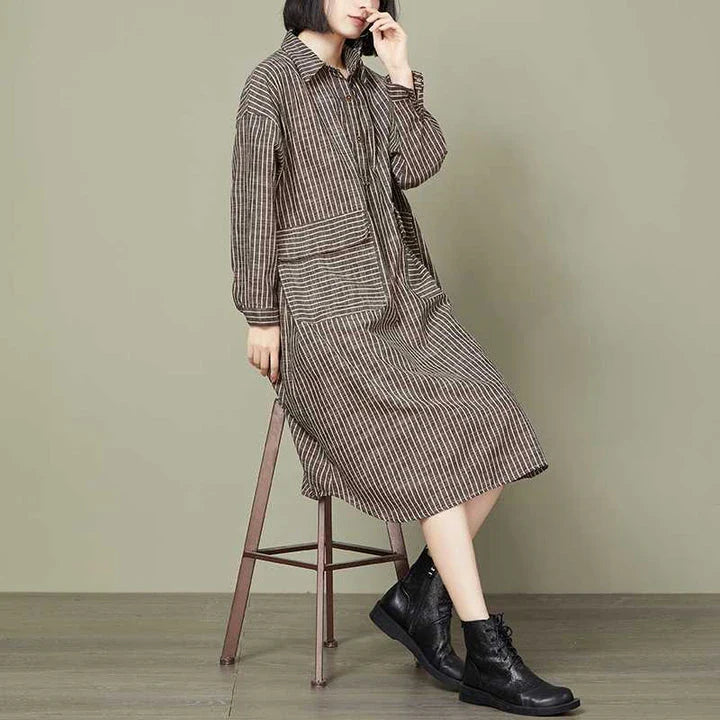 Plus-size women's dress with a striped pattern, asymmetric skirt, and long loose sleeves