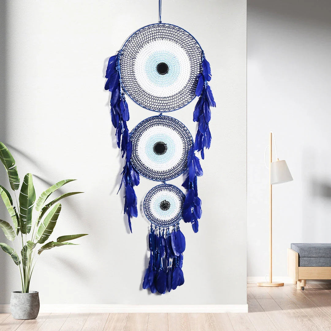Colourful three-ring dreamcatcher wall hanging with feathers and beads, a unique and eye-catching home decor accent