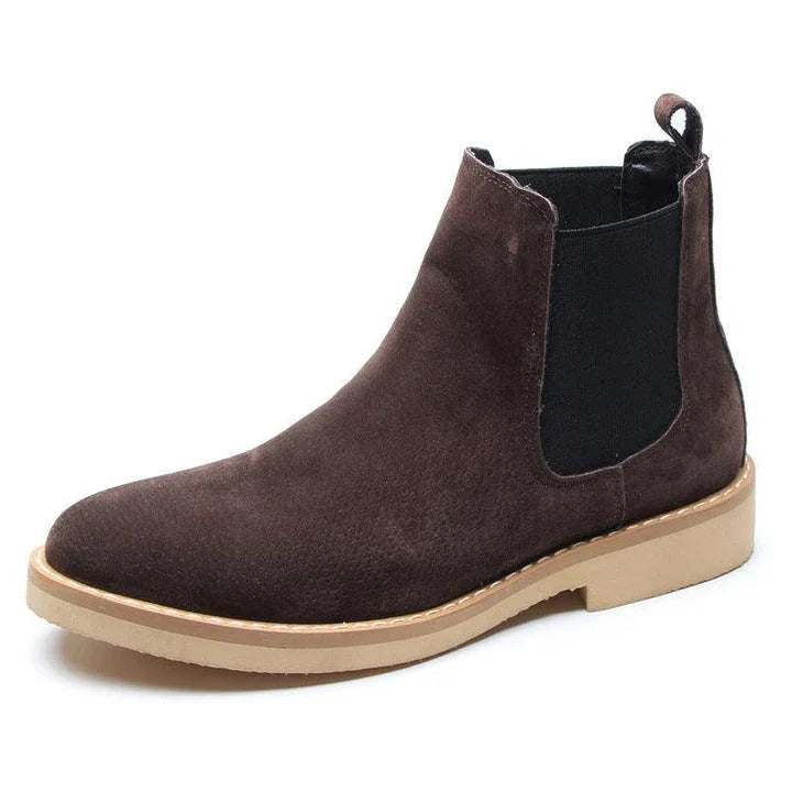 Stylish British-crafted Martin boots with a microfibre upper, pointed toe, and rubber sole for superior comfort and stability.