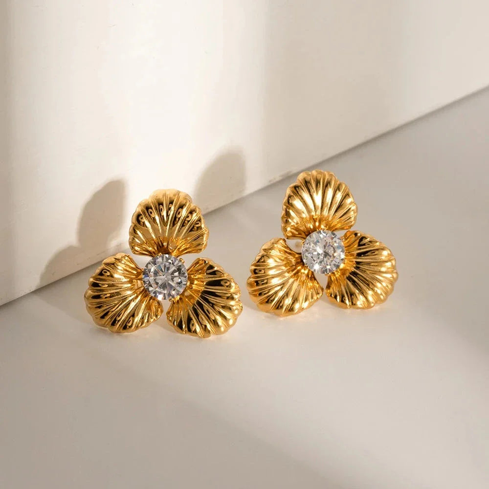 Elegant 18K gold-plated stainless steel flower stud earrings with sparkling zircon inlays, designed for timeless style and all-day comfort.