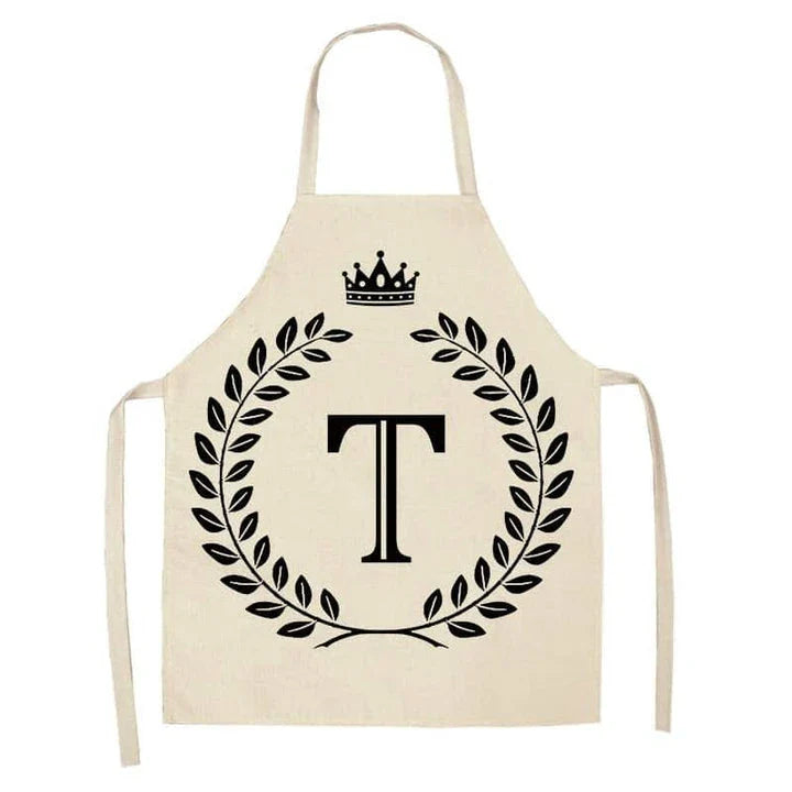 A high-quality kitchen apron featuring a charming crown and letter print design in a premium cotton and linen blend fabric.