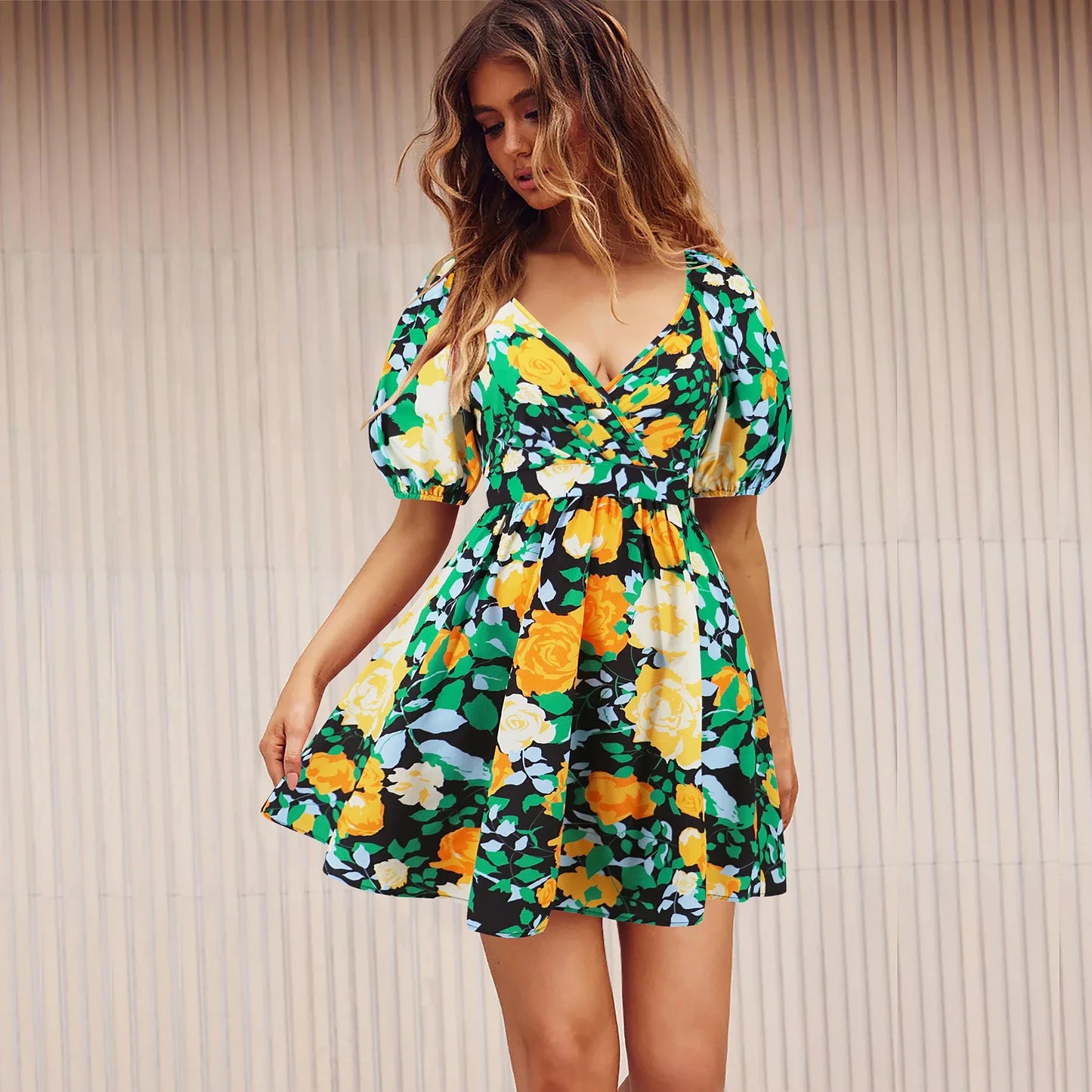 Stylish lantern-sleeve v-neck beach dress in vibrant summer colours, featuring a flattering fit and comfortable stretch fabric