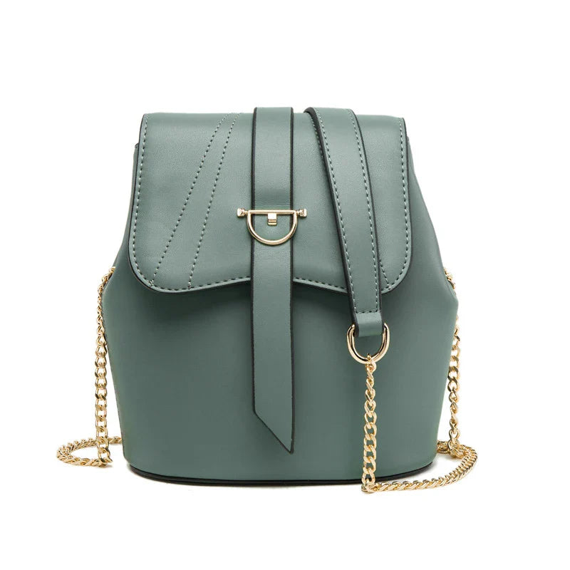A large capacity chain bag with a classic bucket silhouette, crafted from premium leather-look material for sophisticated British style.