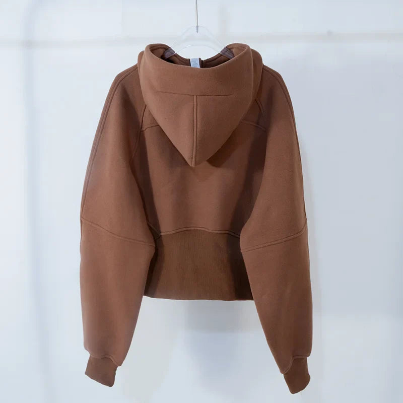 Premium women's sports fleece hoodie with half zip, available in a range of sophisticated colours
