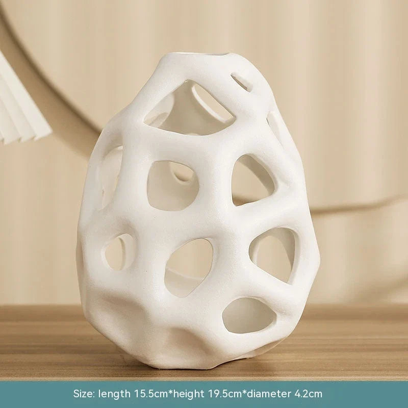 Stylish ceramic decorative balls in geometric design, available in white and black, small and large sizes, for modern home decor