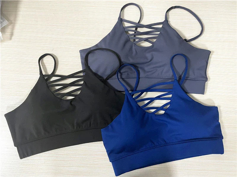 A 3-piece sports set including a hooded top, sports bra, and high-waisted leggings in a black colour scheme.