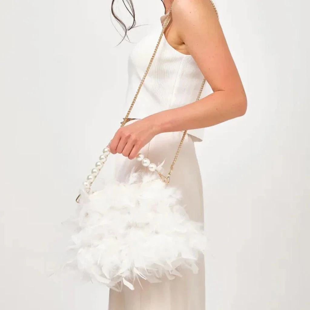 Elegant feather clutch purse with lustrous pearls, metal chains, and a top handle design