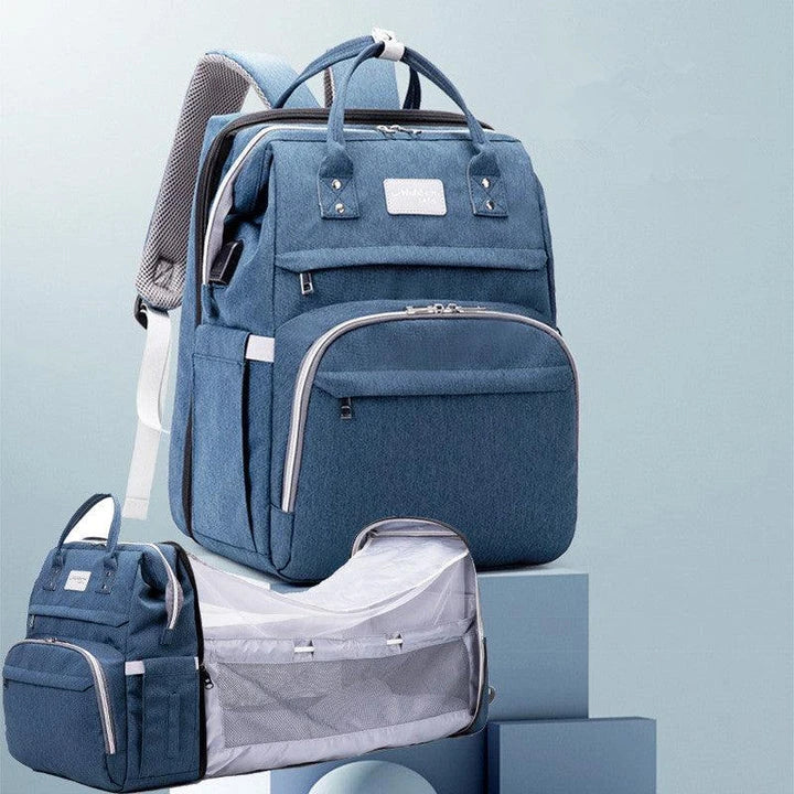 Multifunctional maternity diaper backpack with removable mosquito net, foldable crib, and water-resistant design for convenient family travel