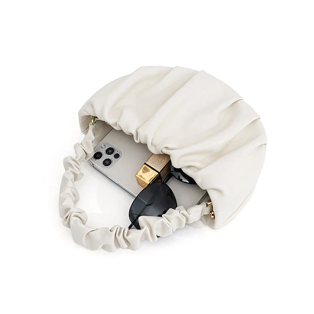 Luxurious sheepskin pleated crossbody bag in various colours, featuring a chic and contemporary design perfect for any occasion.