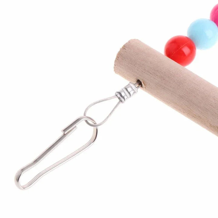 Sturdy wooden rainbow ladder with two hanging hooks, designed as a colourful climbing toy for pet birds